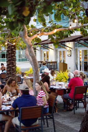  People eating outside of Agua Cayman 