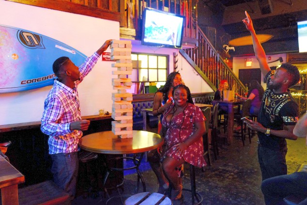  People Playing Games at The Lodge Cayman Bar 