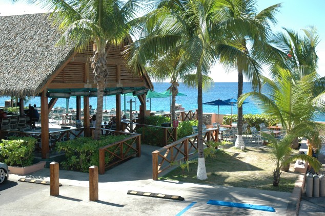  Sunset House Outside Entrance and Palm Trees 