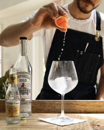  Employee making a cocktail at Anchor and Den 