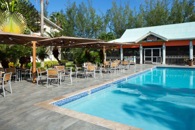 Sunshine Grill Cayman Outside pool and cahirs 